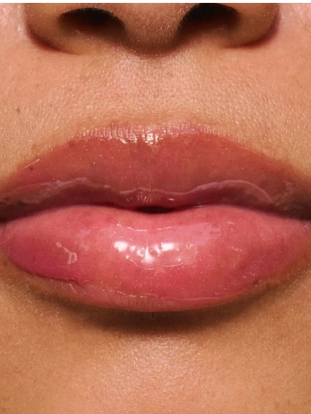 LALICIOUS Hydrating Butter Gloss SPF 30 in Berry Bomb shine shield plump hydrate